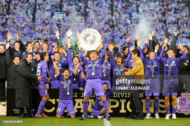 Toshihiro Aoyama of Sanfrecce Hiroshima lifts the J.League J1 Champion Schale at the J.League J1 award ceremony following the J.League J1 match...