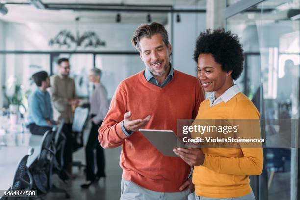 business people in the office. - two people standing stock pictures, royalty-free photos & images