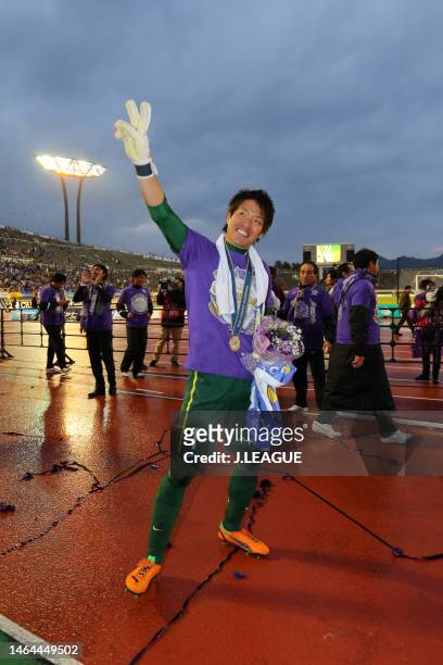 Shusaku Nishikawa of Sanfrecce Hiroshima applauds fans as the team celebrates the J.League J1 Champions following the J.League J1 match between...