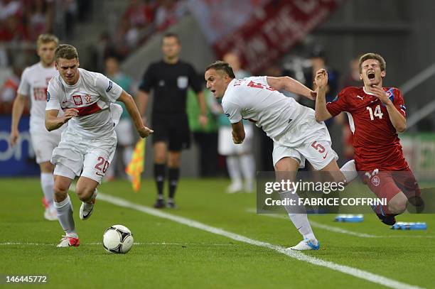 Czech midfielder Vaclav Pilar vies with Polish midfielder Dariusz Dudka and Polish defender Lukasz Piszczek during the Euro 2012 championships...