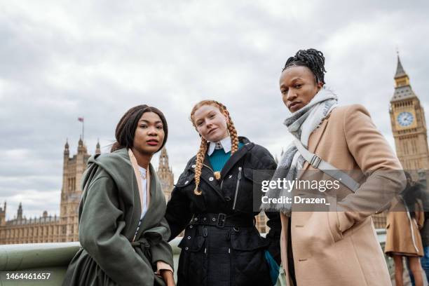 group of young diverse people in london, uk, looking at camera with serious expression - northern european stock pictures, royalty-free photos & images