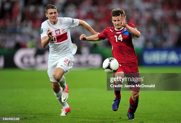 Lukasz Piszczek of Poland and Vaclav Pilar of Czech Republic compete for the ball during the UEFA EURO 2012 group A match between Czech Republic and...