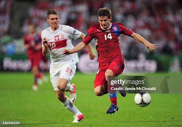 Lukasz Piszczek of Poland and Vaclav Pilar of Czech Republic compete for the ball during the UEFA EURO 2012 group A match between Czech Republic and...