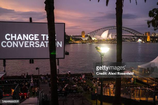 People attend The Sydney Westpac Open Air Cinema with the words "Change the Conversation" displayed at Mrs Macquaries Point Royal Botanic Garden on...