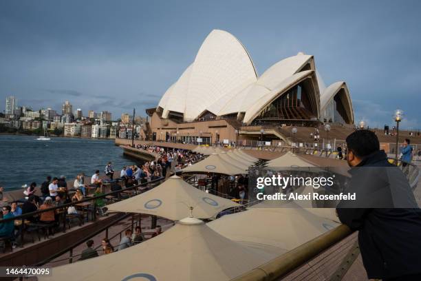 People sit at restaurants outside The Sydney Opera House on February 09, 2023 in Sydney, Australia. On July 6, 2022 the Australian government lifted...