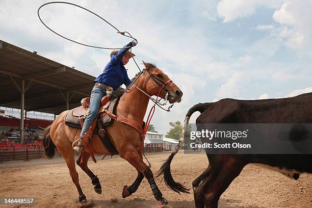 Candice Hill competes in the breakaway roping competition at the Illinois High School Rodeo Association State Finals on June 16, 2012 in Altamont,...