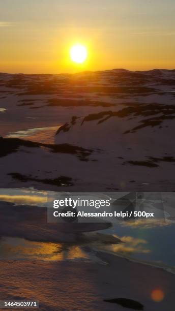 scenic view of sea against sky during sunset,iqaluit,nunavut,canada - iqaluit stock pictures, royalty-free photos & images