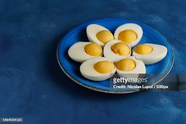 high angle view of eggs in plate on table,roman,romania - hard boiled eggs stock-fotos und bilder