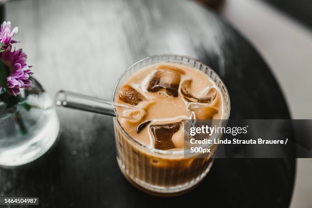 close-up of drink in glass on table,riga,latvia - eiswürfel stock-fotos und bilder