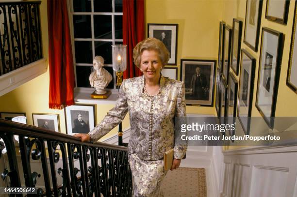 Conservative Party politician and Prime Minister of the United Kingdom Margaret Thatcher posed on the main staircase of 10 Downing Street off...