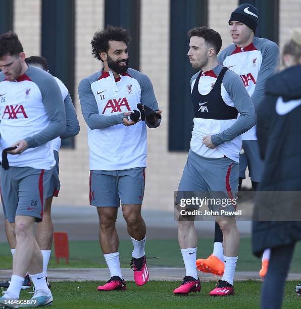 Diogo Jota of Liverpool with Mohamed Salah of Liverpool during a training session at AXA Training Centre on February 09, 2023 in Kirkby, England.