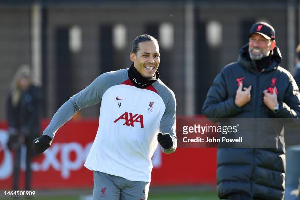 Virgil van Dijk of Liverpool with Jurgen Klopp manager of Liverpool during a training session at AXA Training Centre on February 09, 2023 in Kirkby,...