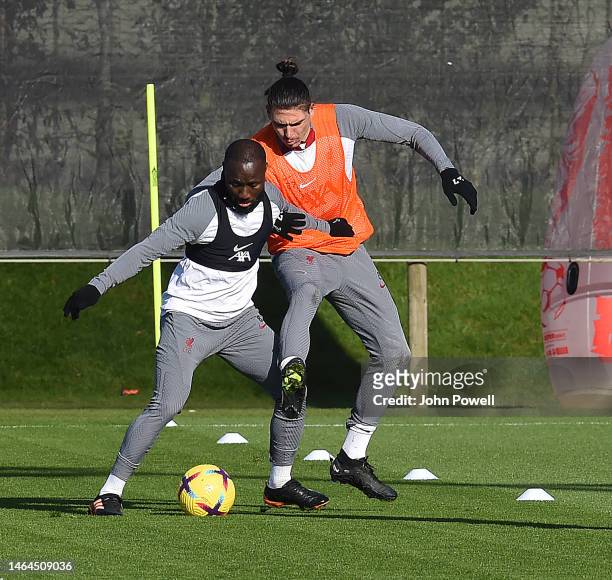 Darwin Nunez of Liverpool with Naby Keita of Liverpool during a training session at AXA Training Centre on February 09, 2023 in Kirkby, England.