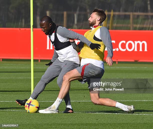 Naby Keita of Liverpool with Nathaniel Phillips of Liverpool during a training session at AXA Training Centre on February 09, 2023 in Kirkby, England.