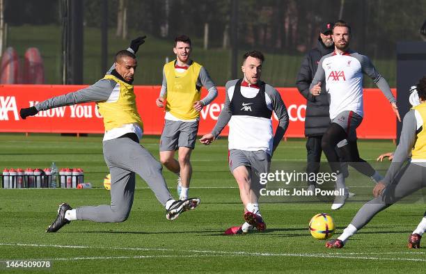 Joel Matip of Liverpool with Diogo Jota of Liverpool during a training session at AXA Training Centre on February 09, 2023 in Kirkby, England.