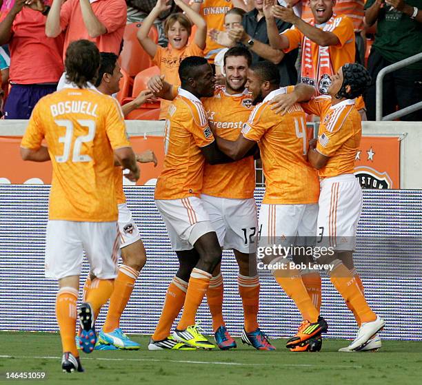 Will Bruin of the Houston Dynamo celebrates with Je-Vaughn Watson, Jermaine Taylor and Calen Carr after his score in the first half against FC Dallas...