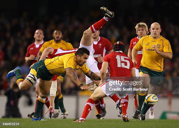 Digby Ioane of the Wallabies competes for the ball with Rhys Priestland of Wales during the International Test Match between the Australian Wallabies...