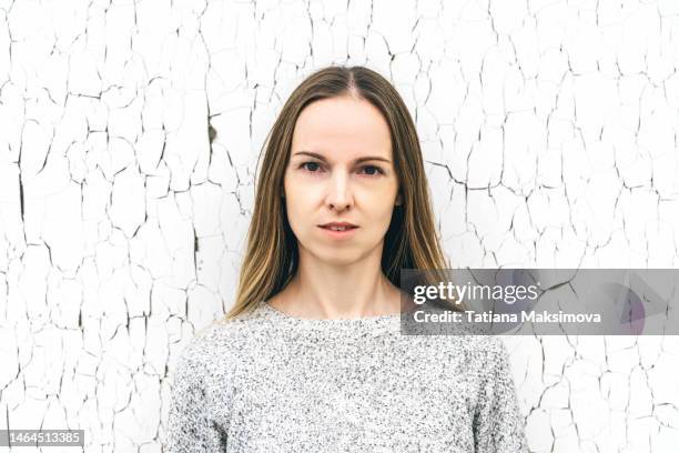 young real woman with natural skin on texture white background. the concept of natural aging, naturalness and self-care. - brutal honesty stock pictures, royalty-free photos & images