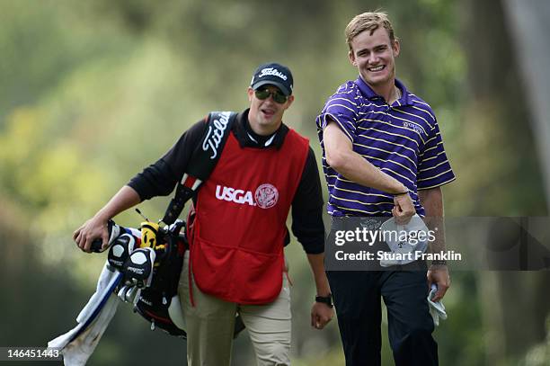 John Peterson of the United States celebrates a hole-in-one on the 13th hole with his caddie Gentry Mangun during the third round of the 112th U.S....