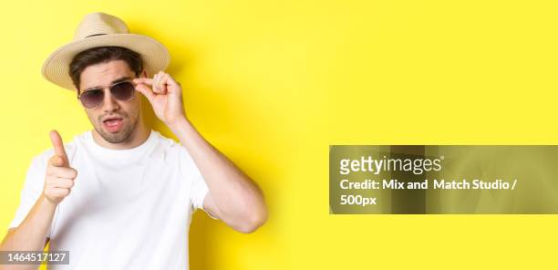 concept of tourism and vacation cool and sassy man flirting with you - sassy shades foto e immagini stock