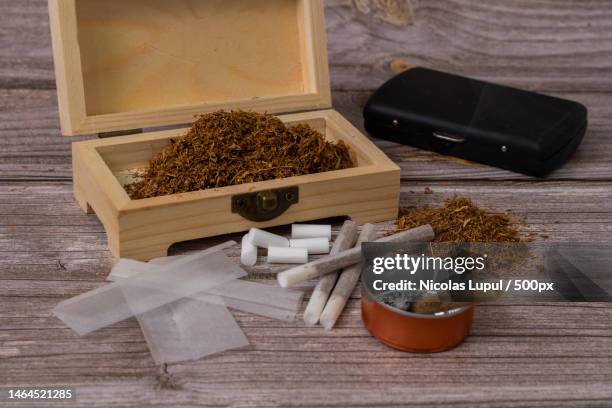 high angle view of spices in mortar and pestle on table,roman,romania - tobacco product stockfoto's en -beelden