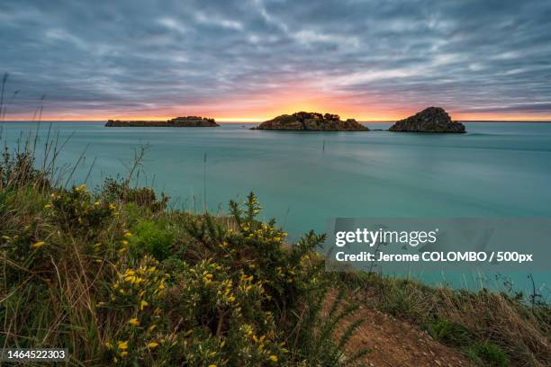 scenic view of sea against sky during sunset,cancale,france - cancale bildbanksfoton och bilder