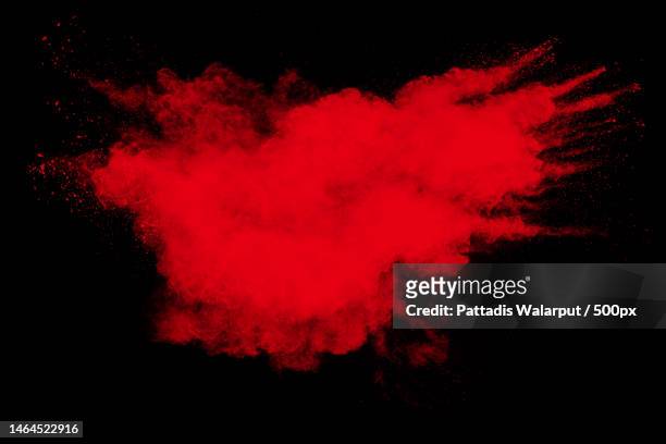 red powder explosion cloud on black background freeze motion of red color dust particle splashing,thailand - launching event stock pictures, royalty-free photos & images