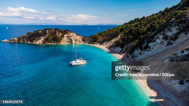 high angle view of sailboat in sea against sky,ithaca,ithaki,greece - ithaca stock pictures, royalty-free photos & images