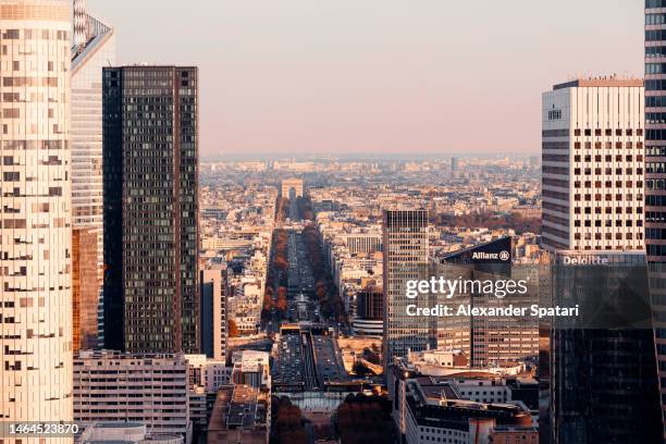 la defense skyscrapers, avenue des champs-élysées and arc de triomphe, paris, france - triumphal arch stock pictures, royalty-free photos & images