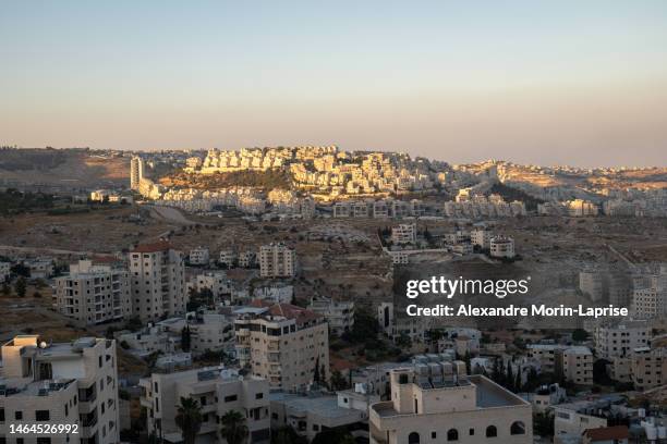 bethlehem, west bank, palestine - 22 july 2022: cityscape at dusk with last sun rays over the white stone buildings - east stock pictures, royalty-free photos & images