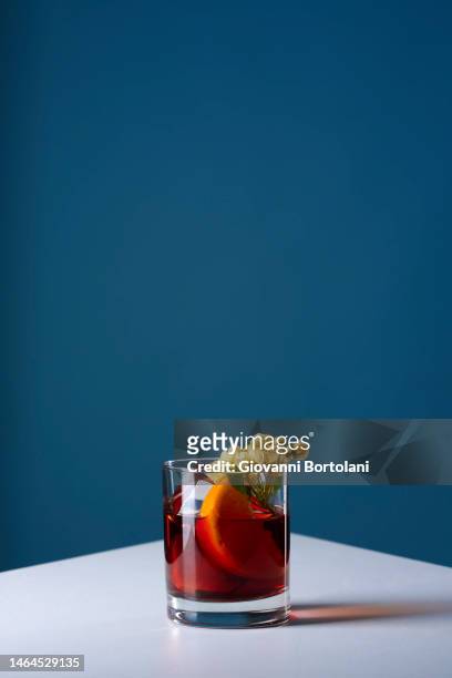 negroni cocktail with edible flowers - vintage food and drink stock pictures, royalty-free photos & images