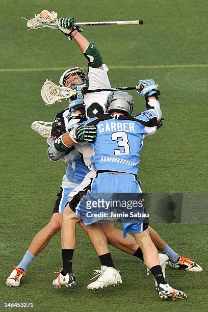 Stephen Peyser of the Long Island Lizards is sandwiched by the defense of Connor Martin of the Ohio Machine and Brett Garber of the Ohio Machine in...