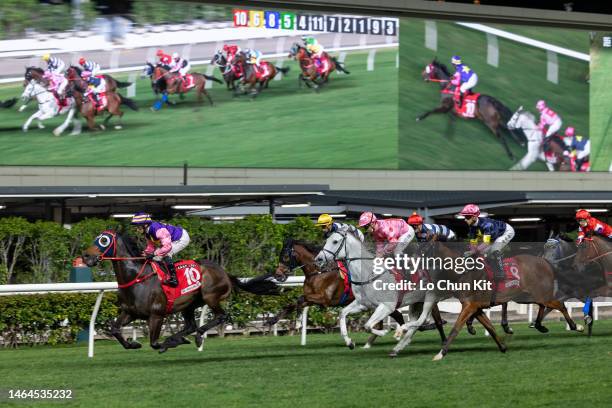 Jockeys compete the Race 7 Shan Kwong Handicap at Happy Valley Racecourse on February 8, 2023 in Hong Kong.