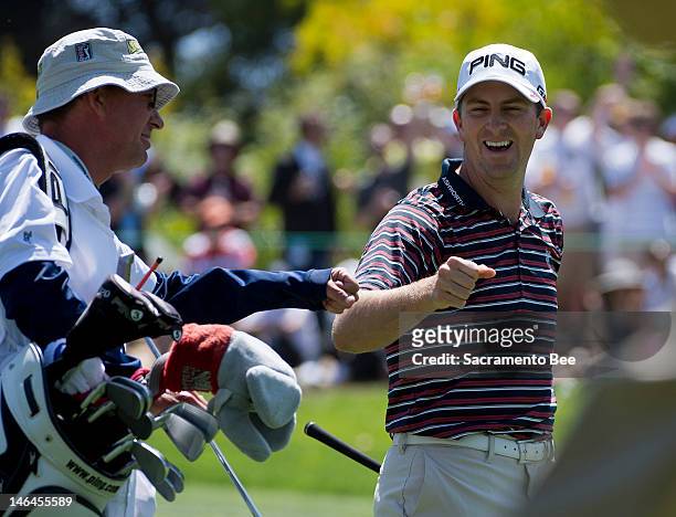 Michael Thompson fist bumps caddie Matt Bednarski on the 1st hole during the third round of the U.S. Open golf tournament at the Olympic Club in San...