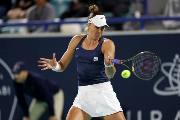 Beatriz Haddad Maia of Brazil plays a forehand against Yulia Putintseva of Kazakhstan during her Women's Singles match on Day 4 of the Mubadala Abu...