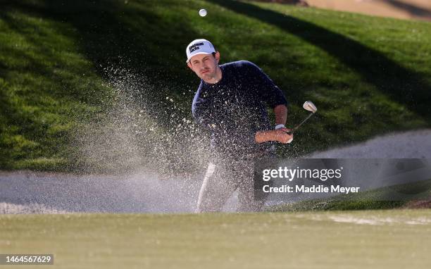 Patrick Cantlay of the United States plays a shot from a bunker on the 12th hole during the first round of the WM Phoenix Open at TPC Scottsdale on...