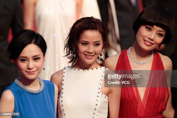 Actresses Gillian Chung, Charlene Choi and Joey Yung arrive at the red carpet during the opening ceremony for the 15th Shanghai International Film...
