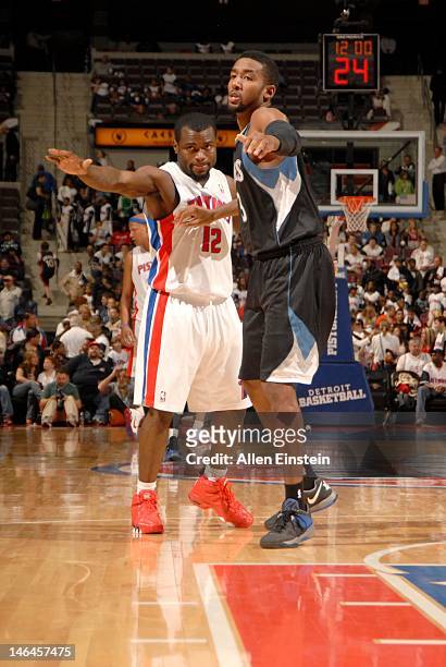 Will Bynum of the Detroit Pistons and Malcolm Lee of the Minnesota Timberwolves guard positions during the game between the Detroit Pistons and the...