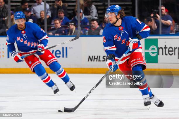 Artemi Panarin of the New York Rangers skates with the puck against the Calgary Flames at Madison Square Garden on February 6, 2023 in New York City.