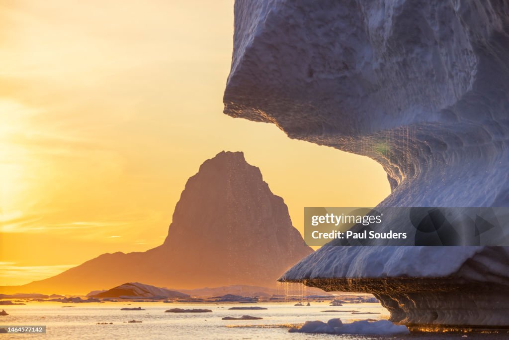 Setting Midnight Sun lights Glacial Icebergs in Uummannaq Fjord, Greenland