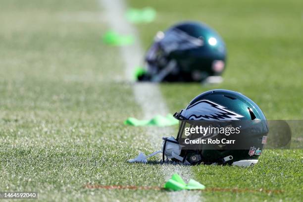 Detailed view of a Philadelphia Eagles helmet lays on the field in a practice session prior to Super Bowl LVII at Arizona Cardinals Training Center...