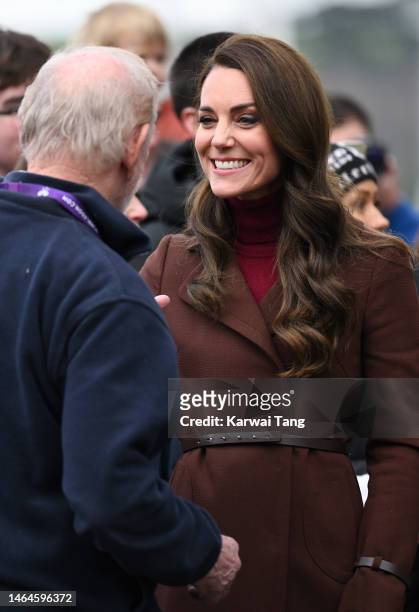 Catherine, Princess of Wales meets her former school teacher Jim Embury during a visit to the National Maritime Museum Cornwall with Prince William,...