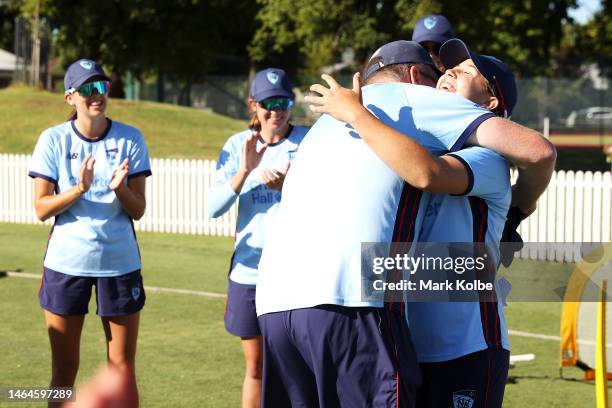 Isabella Malgioglio of the NSW Breakers is presented with her baggy blue by Breakers assistant coach Grant Lambert during her NSW cap presentation...