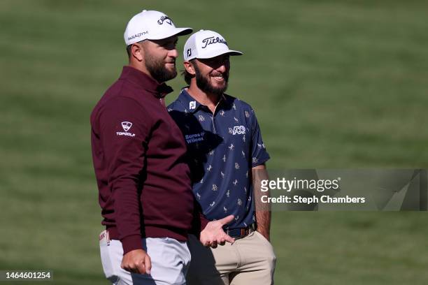 Jon Rahm of Spain and Max Homa of the United States stand on the second hole during the first round of the WM Phoenix Open at TPC Scottsdale on...