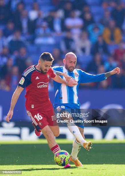 Aleix Vidal of RCD Espanyol competes for the ball with Moi Gomez of CA Osasuna during the LaLiga Santander match between RCD Espanyol and CA Osasuna...