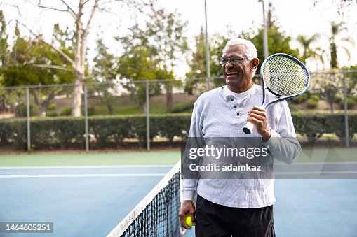 Portrait of a senior black man on the tennis court