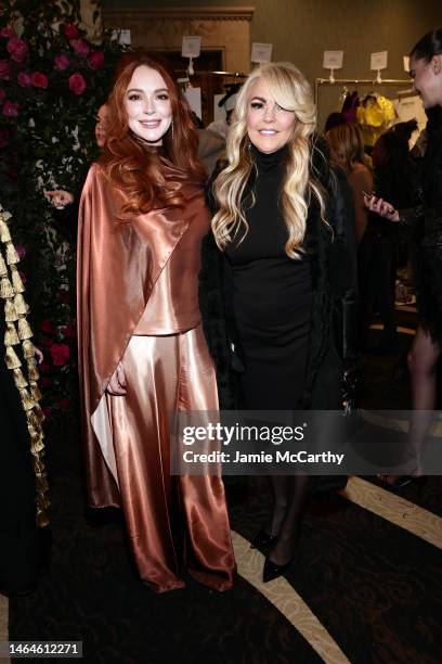 Lindsay Lohan and Dina Lohan pose backstage at the Christian Siriano Fall/Winter 2023 NYFW Show at Gotham Hall on February 09, 2023 in New York City.