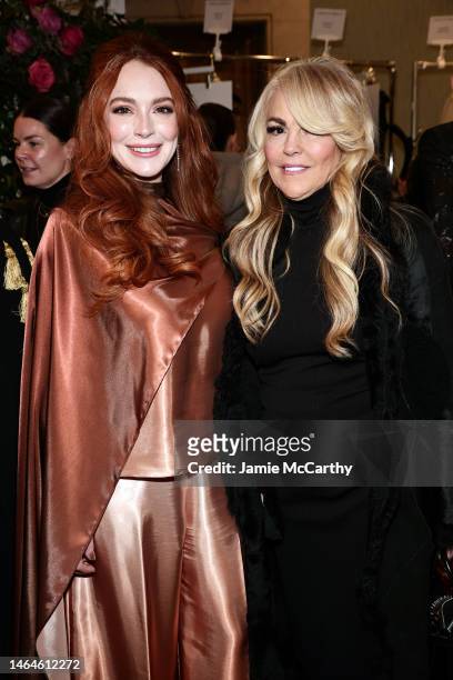 Lindsay Lohan and Dina Lohan pose backstage at the Christian Siriano Fall/Winter 2023 NYFW Show at Gotham Hall on February 09, 2023 in New York City.