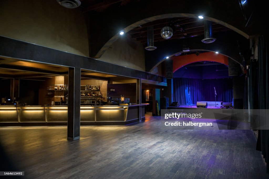 Empty Music Venue with Stage and Bar