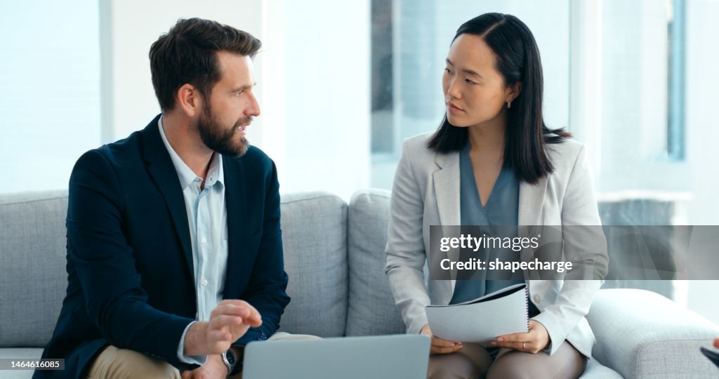 Job interview, woman and man on sofa with feedback on salary negotiation in human resources office. Recruit, hr manager at startup meeting to discuss performance and contract with recruitment agent.